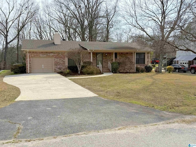 ranch-style home featuring a garage, brick siding, driveway, a front lawn, and a chimney