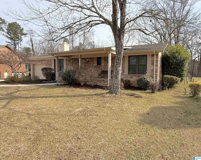 ranch-style house with brick siding, a chimney, a porch, an attached garage, and a front yard