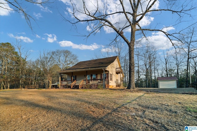 65 Jessica Dr, Wedowee, AL 36278 - exterior space featuring an outbuilding, covered porch, a garage, and a lawn