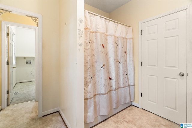 65 Jessica Dr, Wedowee, AL 36278 - full bathroom with a shower with shower curtain and baseboards