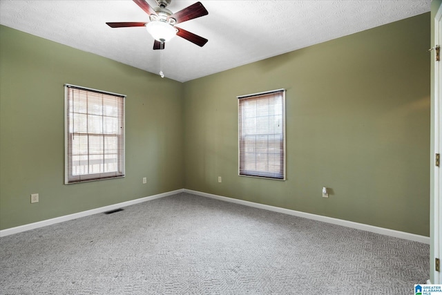 65 Jessica Dr, Wedowee, AL 36278 - unfurnished room featuring ceiling fan, baseboards, carpet flooring, and visible vents