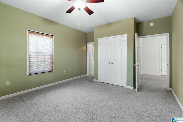 65 Jessica Dr, Wedowee, AL 36278 - unfurnished bedroom with ceiling fan, a closet, baseboards, and carpet floors