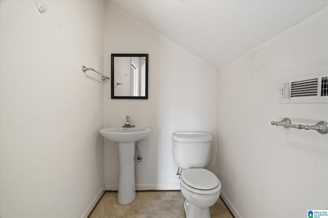 65 Jessica Dr, Wedowee, AL 36278 - bathroom with visible vents, baseboards, toilet, and lofted ceiling