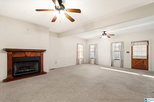 65 Jessica Dr, Wedowee, AL 36278 - unfurnished living room featuring carpet, a fireplace with raised hearth, baseboards, and ceiling fan