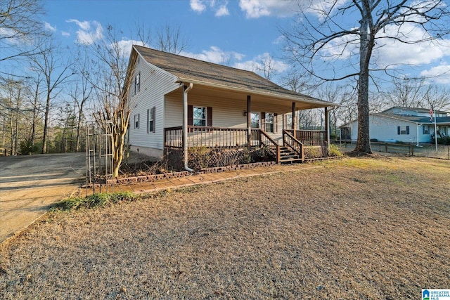 65 Jessica Dr, Wedowee, AL 36278 - view of front of property featuring covered porch, fence, and driveway