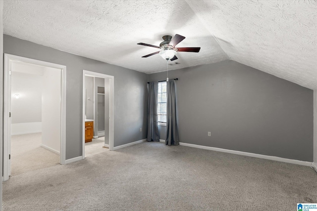 65 Jessica Dr, Wedowee, AL 36278 - unfurnished bedroom with lofted ceiling, a ceiling fan, light colored carpet, and a textured ceiling