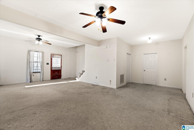 65 Jessica Dr, Wedowee, AL 36278 - unfurnished living room with baseboards, light colored carpet, and a ceiling fan