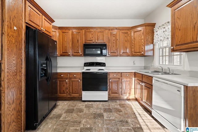 65 Jessica Dr, Wedowee, AL 36278 - kitchen with brown cabinetry, a sink, and black appliances