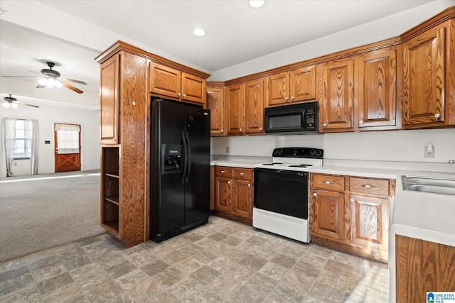 65 Jessica Dr, Wedowee, AL 36278 - kitchen featuring light countertops, black appliances, brown cabinets, ceiling fan, and a sink