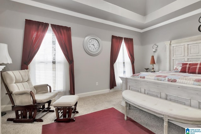 bedroom featuring carpet floors, ornamental molding, and baseboards