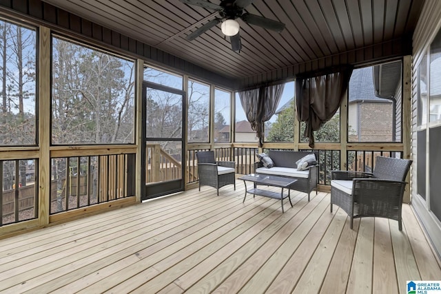 sunroom with wooden ceiling and ceiling fan