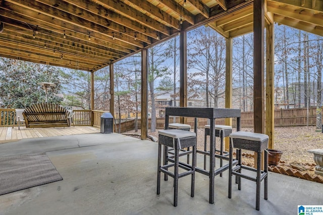 view of patio featuring fence