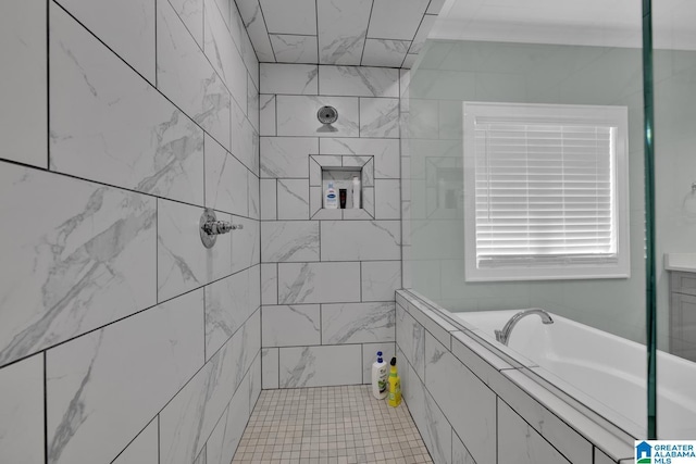 bathroom featuring a bath and tiled shower