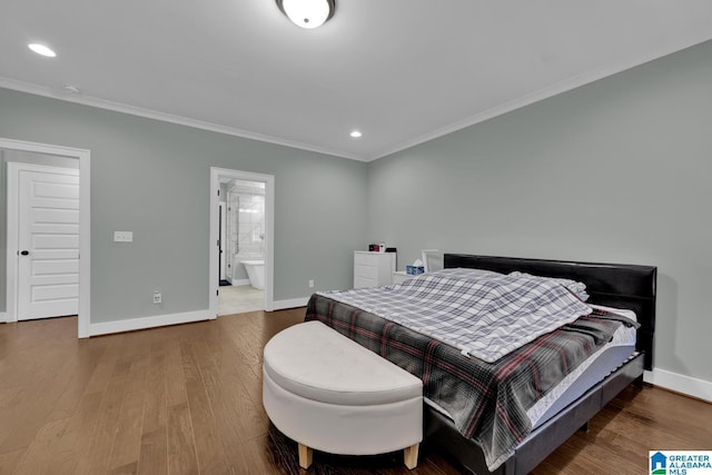 bedroom with crown molding, baseboards, recessed lighting, ensuite bathroom, and wood finished floors