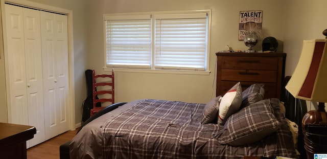 bedroom with a closet and wood finished floors