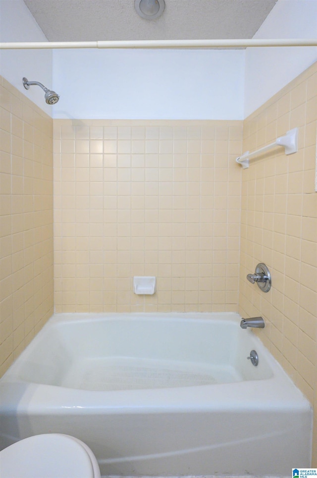 full bathroom featuring toilet and shower / bathing tub combination