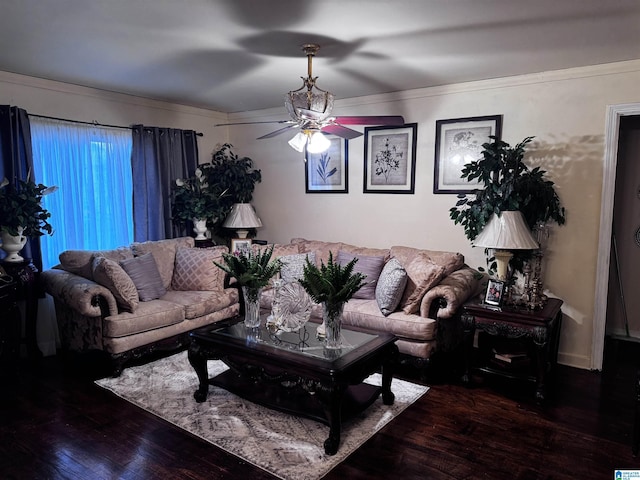 living room featuring a ceiling fan and wood finished floors