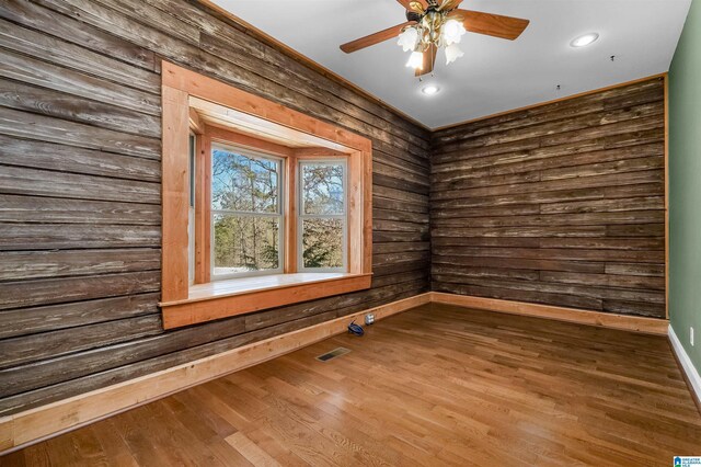 spare room with ceiling fan, visible vents, wood finished floors, and recessed lighting