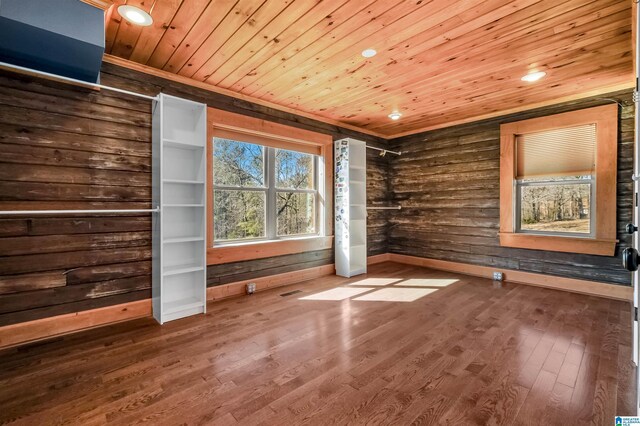 unfurnished bedroom with wooden ceiling, baseboards, wood finished floors, and recessed lighting