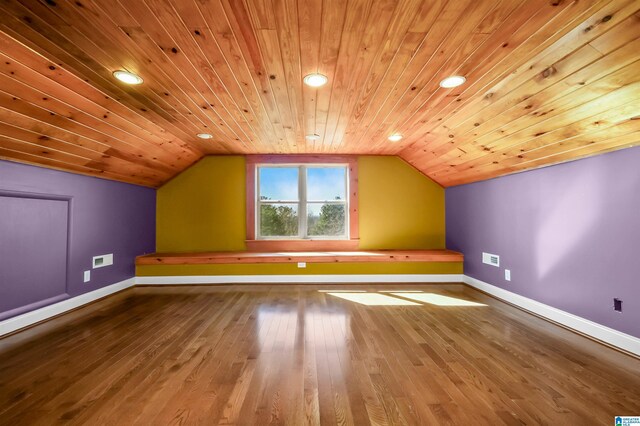 bonus room featuring lofted ceiling, wood finished floors, and baseboards