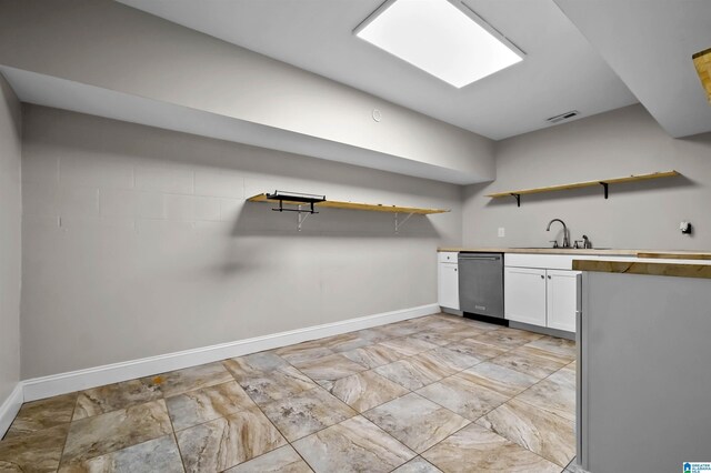 kitchen featuring dishwasher, open shelves, visible vents, and white cabinetry