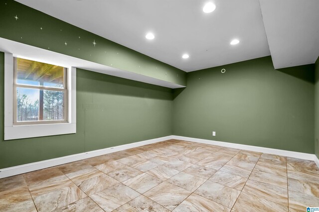 interior space with recessed lighting and baseboards