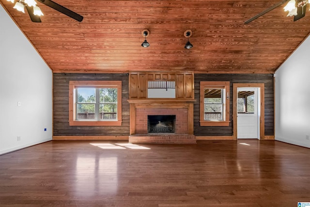 unfurnished living room featuring vaulted ceiling, wooden ceiling, and ceiling fan