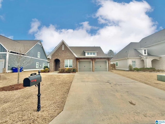 view of front of house with a garage, concrete driveway, and brick siding