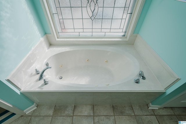 full bathroom with a jetted tub