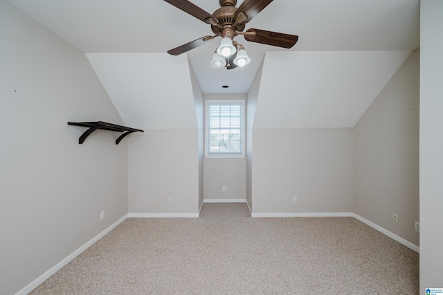 bonus room with lofted ceiling, carpet, ceiling fan, and baseboards