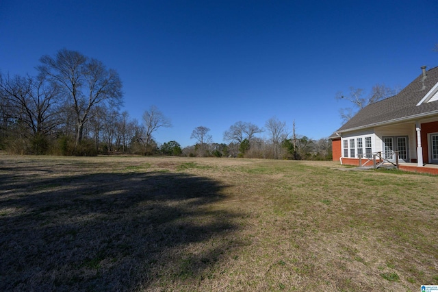 view of yard with french doors