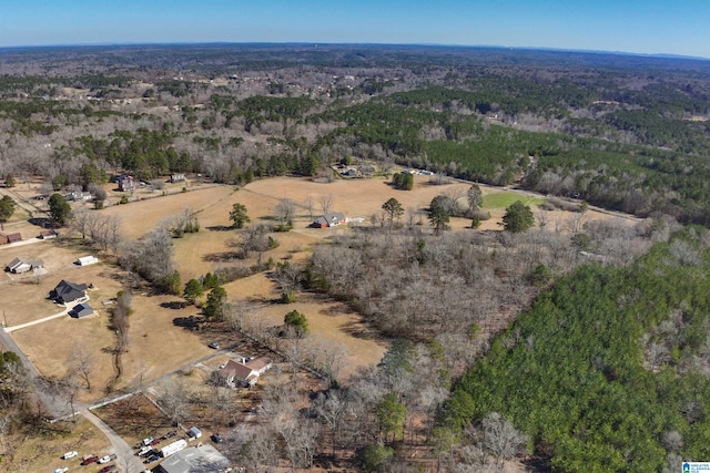 aerial view featuring a view of trees