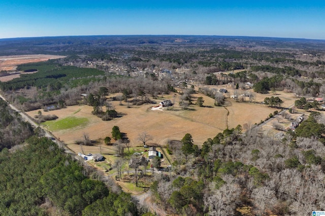 birds eye view of property with a rural view