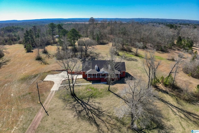 birds eye view of property with a forest view