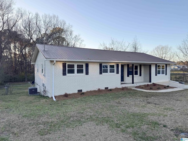 single story home with brick siding, covered porch, crawl space, metal roof, and a front lawn