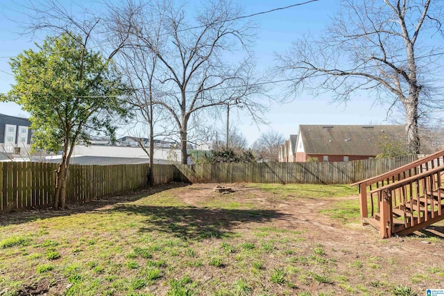 view of yard with a fenced backyard
