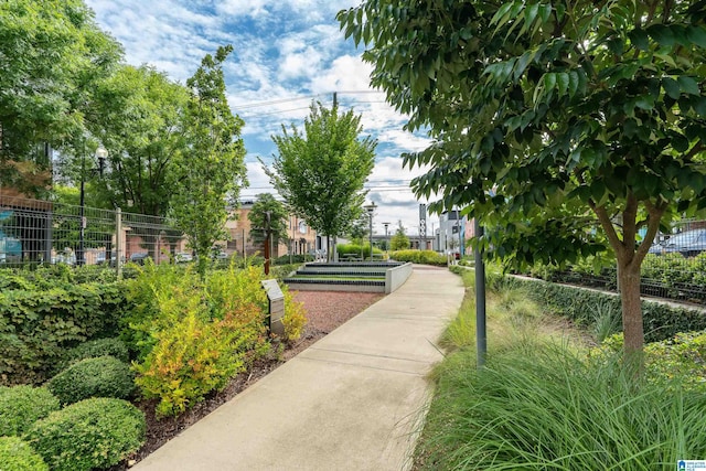 view of community featuring fence