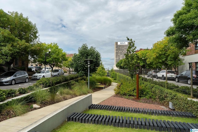 view of property's community featuring fence
