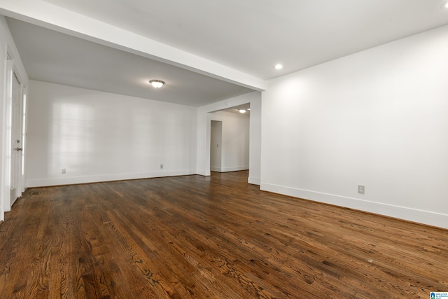 unfurnished room featuring dark wood-style floors, recessed lighting, and baseboards