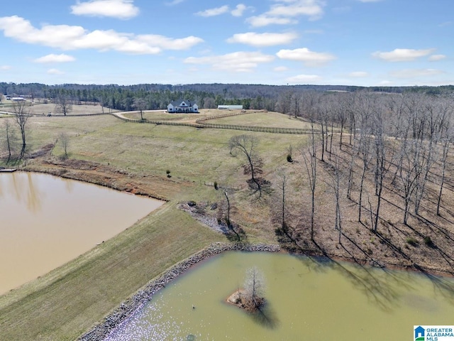 drone / aerial view featuring a rural view and a water view