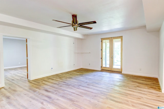 empty room featuring french doors, ceiling fan, light wood-style flooring, and baseboards