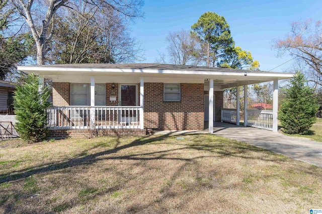 view of front of home featuring a carport, covered porch, brick siding, and driveway