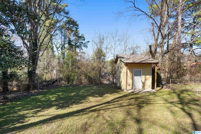 view of yard with an outbuilding, a fenced backyard, and a shed