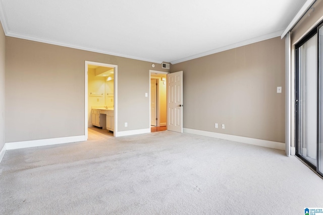 unfurnished bedroom with visible vents, baseboards, and ornamental molding