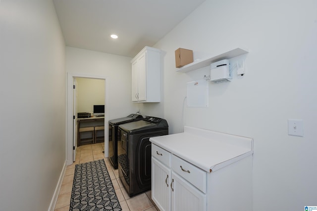 laundry room featuring washing machine and clothes dryer, light tile patterned floors, recessed lighting, cabinet space, and baseboards