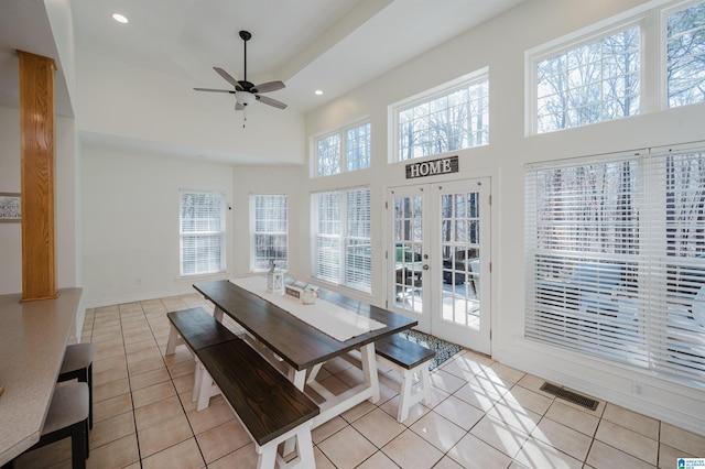 dining area with recessed lighting, visible vents, a high ceiling, and light tile patterned floors