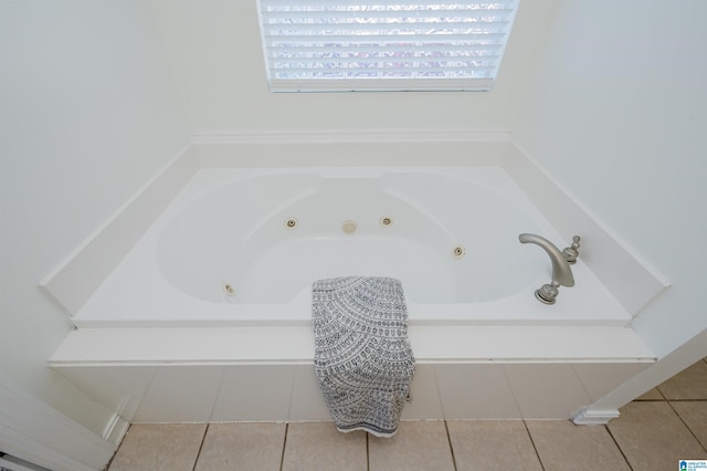 bathroom featuring a tub with jets and tile patterned flooring