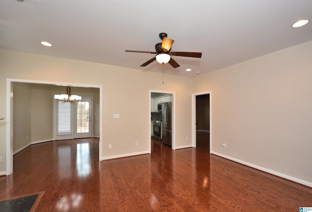 spare room featuring baseboards, wood finished floors, and recessed lighting