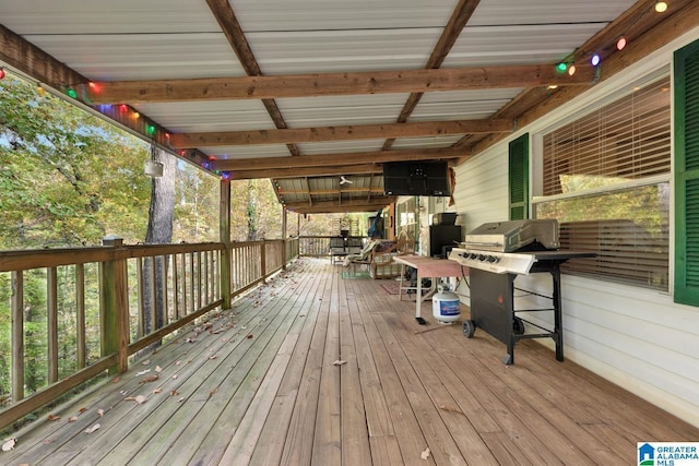 wooden terrace featuring area for grilling