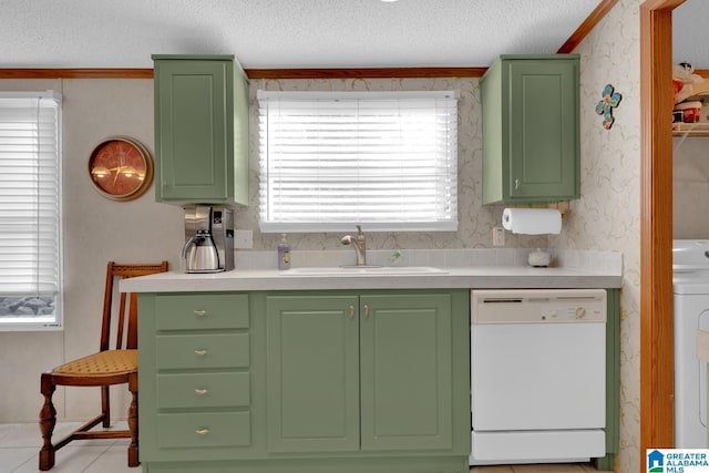 kitchen with dishwasher, green cabinetry, a sink, and wallpapered walls